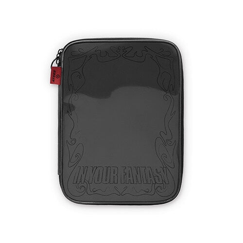 A black zippered sleeve or pouch with a glossy finish, featuring embossed decorative scrollwork and the text 'IN YOUR FANTASY' near the bottom. A small red fabric tag is visible on the left zipper pull.