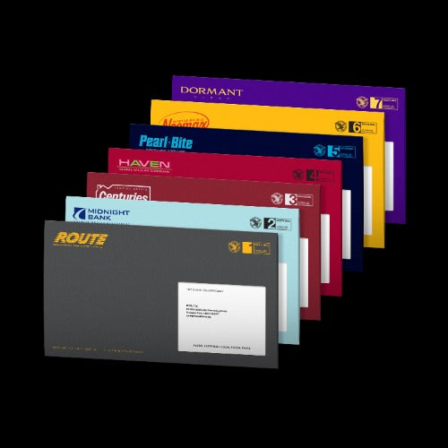 A fan arrangement of Route Bank credit card envelopes in various colors, including purple, yellow, blue, red, maroon, and light blue, displayed against a solid black background.