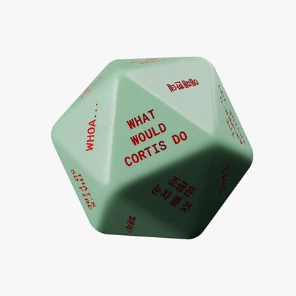 Green die with text 'What Would Cortis Do' on a white background