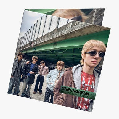 Blurred photo album with 'GREENGREEN' branding on a white background