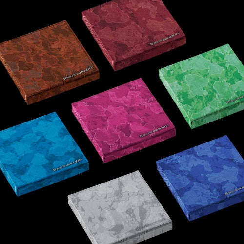 Collection of Enhypen camouflage-patterned albums in various colors on a black background