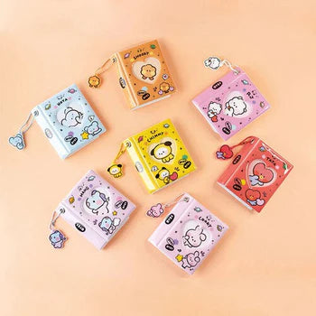 Set of colorful BT21 photo album items with cartoon designs on a beige background
